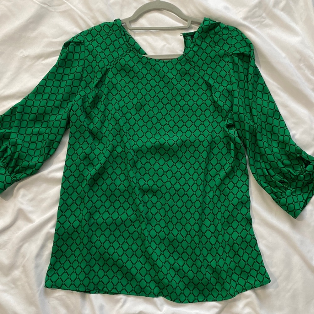 Green blouse with black pattern